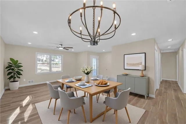 a view of a dining room with furniture and window