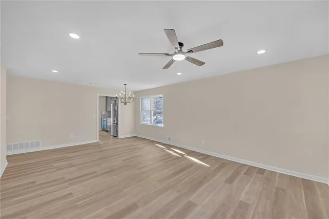 a view of an empty room with a window