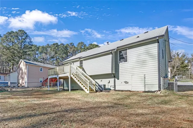 a view of a house with snow on the background