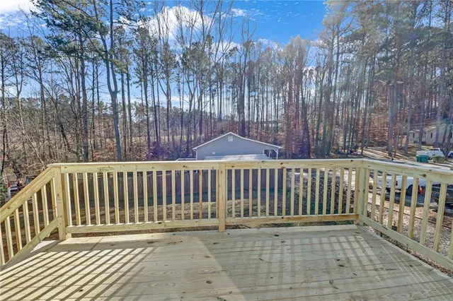 a porch with a bench in front of it