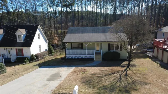 a front view of house with yard nad seating space