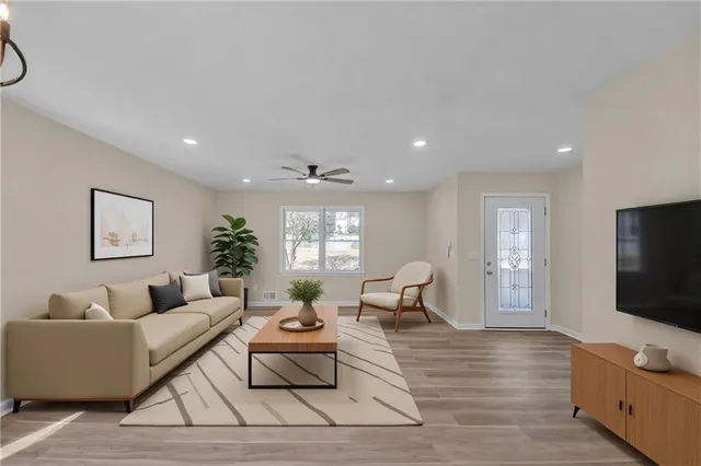 a living room with furniture and a flat screen tv