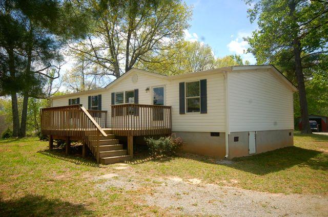 135 Hopkins Road Rocky Mount, VA 24151 - Photo 2 of 21 a view of a house with a yard chairs and wooden fence
