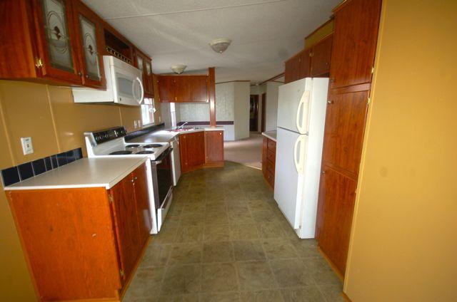 135 Hopkins Road Rocky Mount, VA 24151 - Photo 12 of 21 a kitchen with a refrigerator a sink and a stove