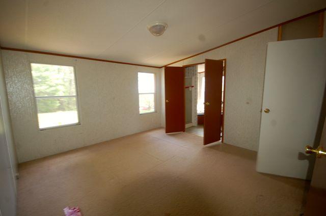 135 Hopkins Road Rocky Mount, VA 24151 - Photo 16 of 21 an empty room with windows
