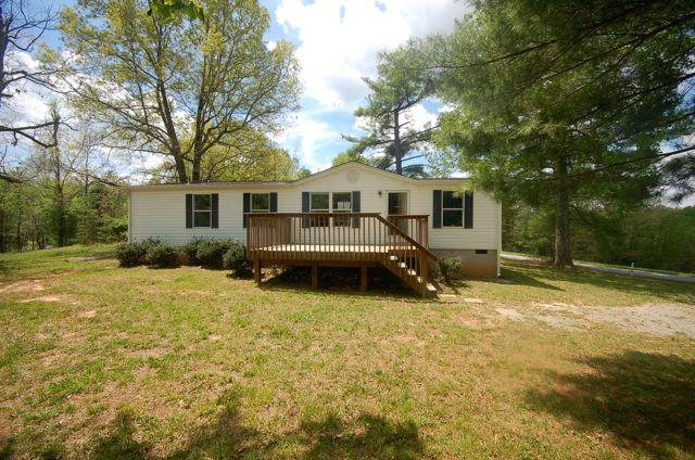 135 Hopkins Road Rocky Mount, VA 24151 - Photo 3 of 21 a front view of house with yard and trees in the background
