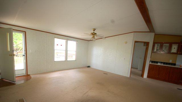 135 Hopkins Road Rocky Mount, VA 24151 - Photo 7 of 21 an empty room with windows and refrigerator