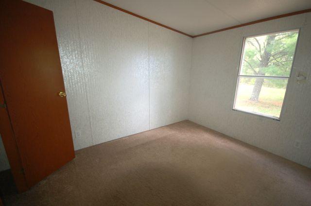 135 Hopkins Road Rocky Mount, VA 24151 - Photo 8 of 21 an empty room with a windows