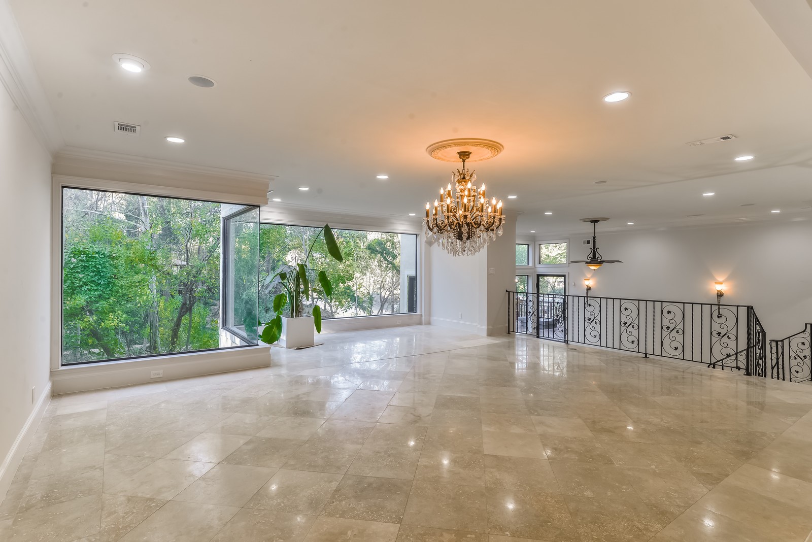 15 West Shady Lane, Unit B Houston, TX 77063 - Photo 10 of 19 a view of a room with a chandelier and living room