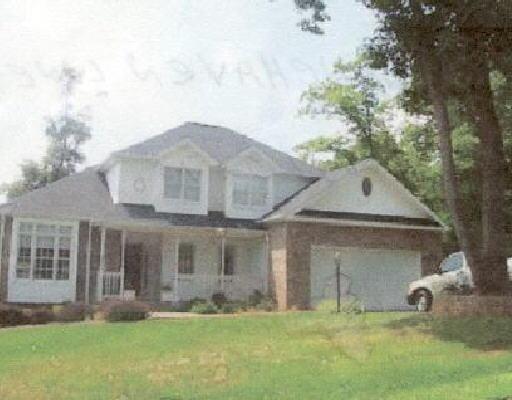 381 Stonehaven Lane Blue Ridge, VA 24064 - Photo 1 of 1 a front view of a house with a yard and garage
