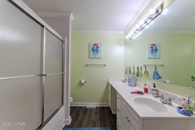 a bathroom with a sink vanity and a mirror