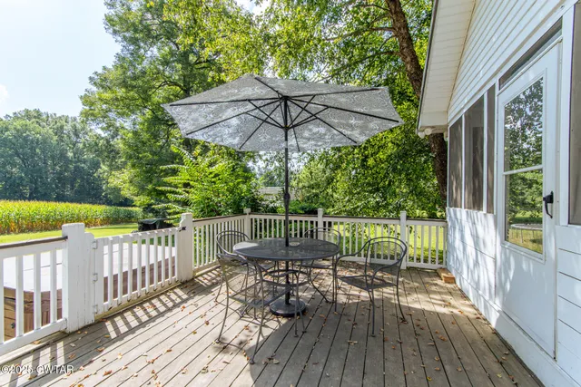 a view of a chair and table on the wooden floor
