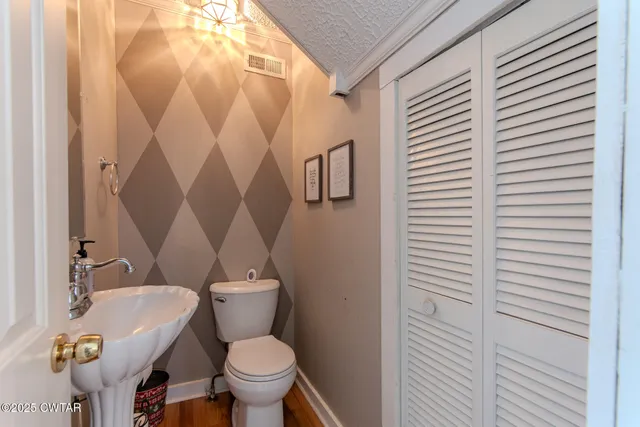 a bathroom with a toilet and a sink