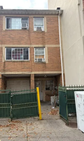 a front view of a house with a garage