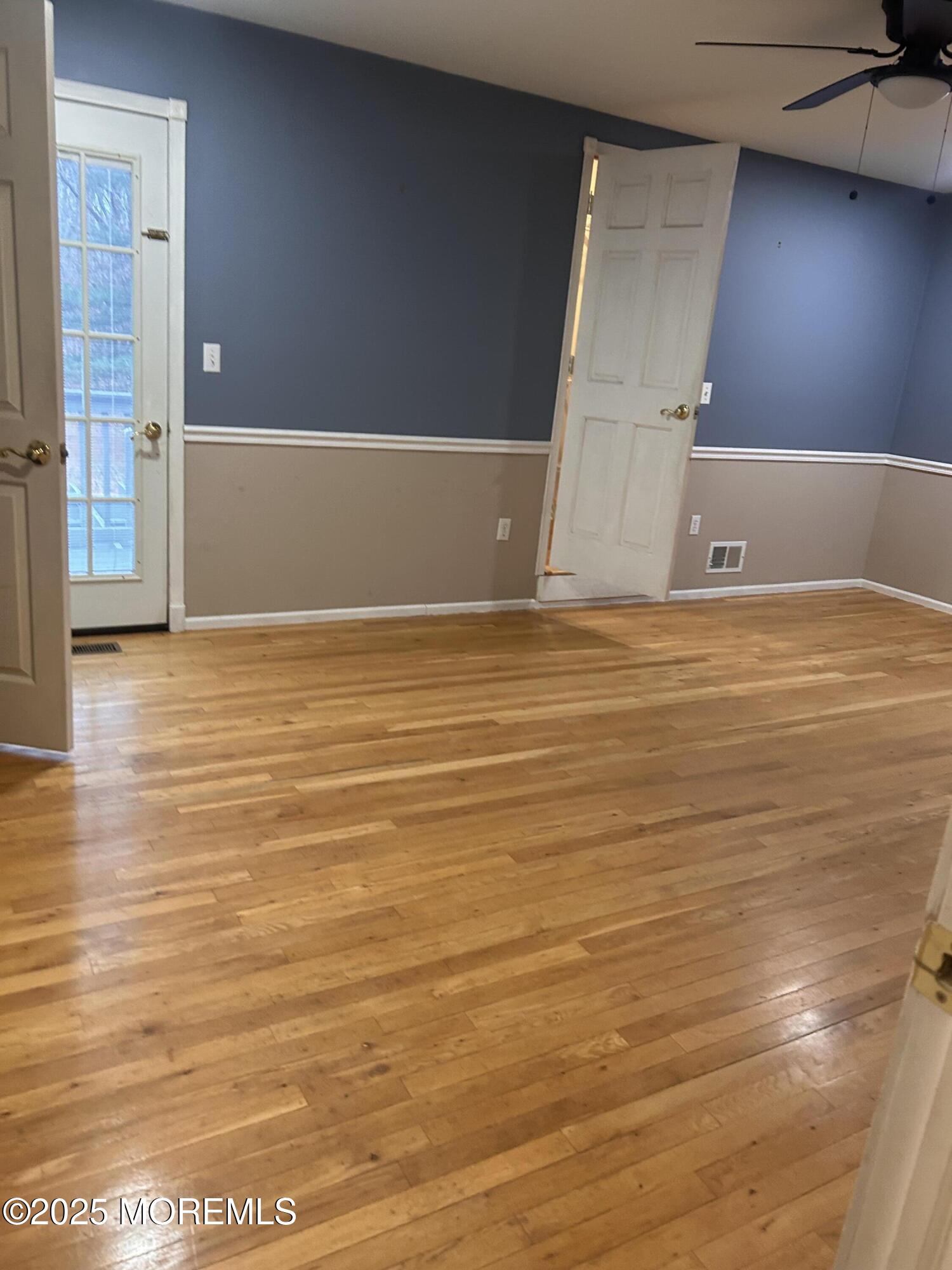 823 Bowman Road Jackson, NJ 08527 - Photo 18 of 27 a view of empty room with wooden floor