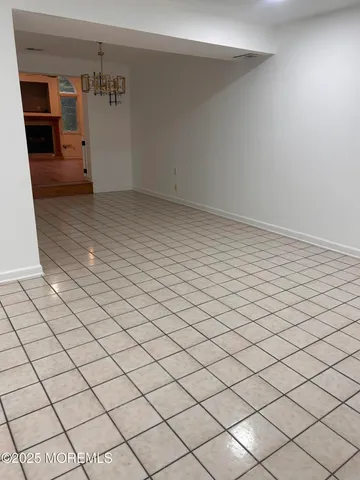 an empty room with wooden floor