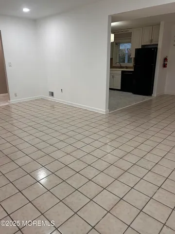 a large kitchen with cabinets and stainless steel appliances
