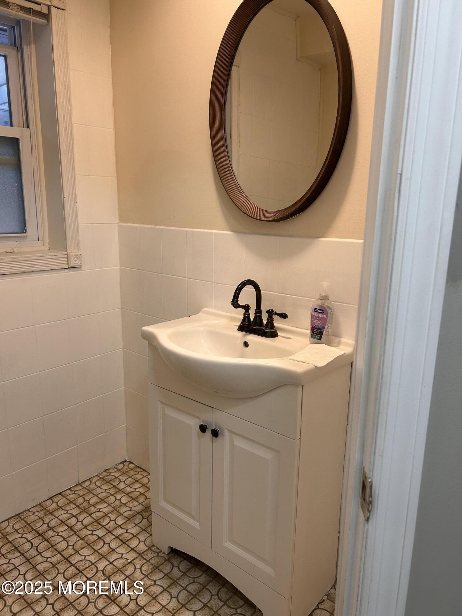 823 Bowman Road Jackson, NJ 08527 - Photo 10 of 27 a bathroom with a sink and a mirror
