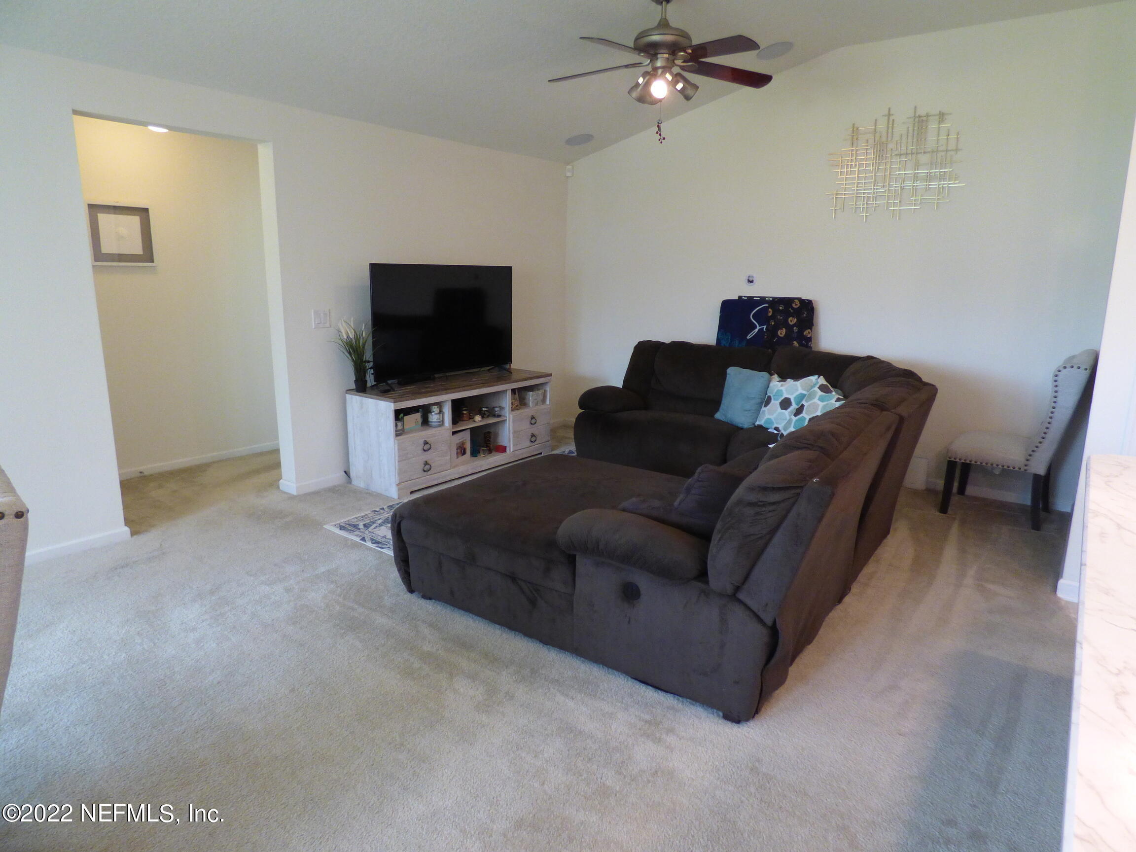 313 Bluejack Lane St. Augustine, FL 32095 - Photo 12 of 46 a living room with furniture and a flat screen tv