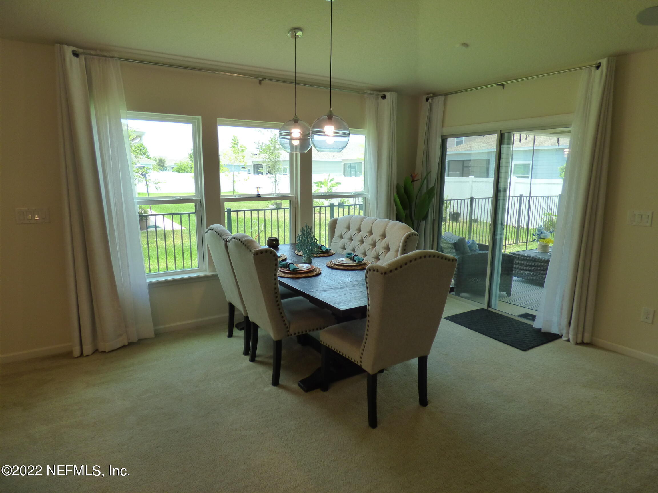 313 Bluejack Lane St. Augustine, FL 32095 - Photo 14 of 46 a view of a dining room with furniture window and outside view
