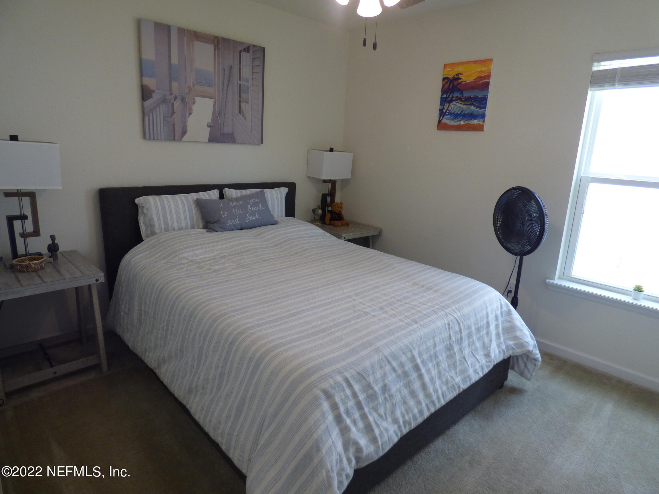 313 Bluejack Lane St. Augustine, FL 32095 - Photo 24 of 46 a bedroom with bed and wall painting