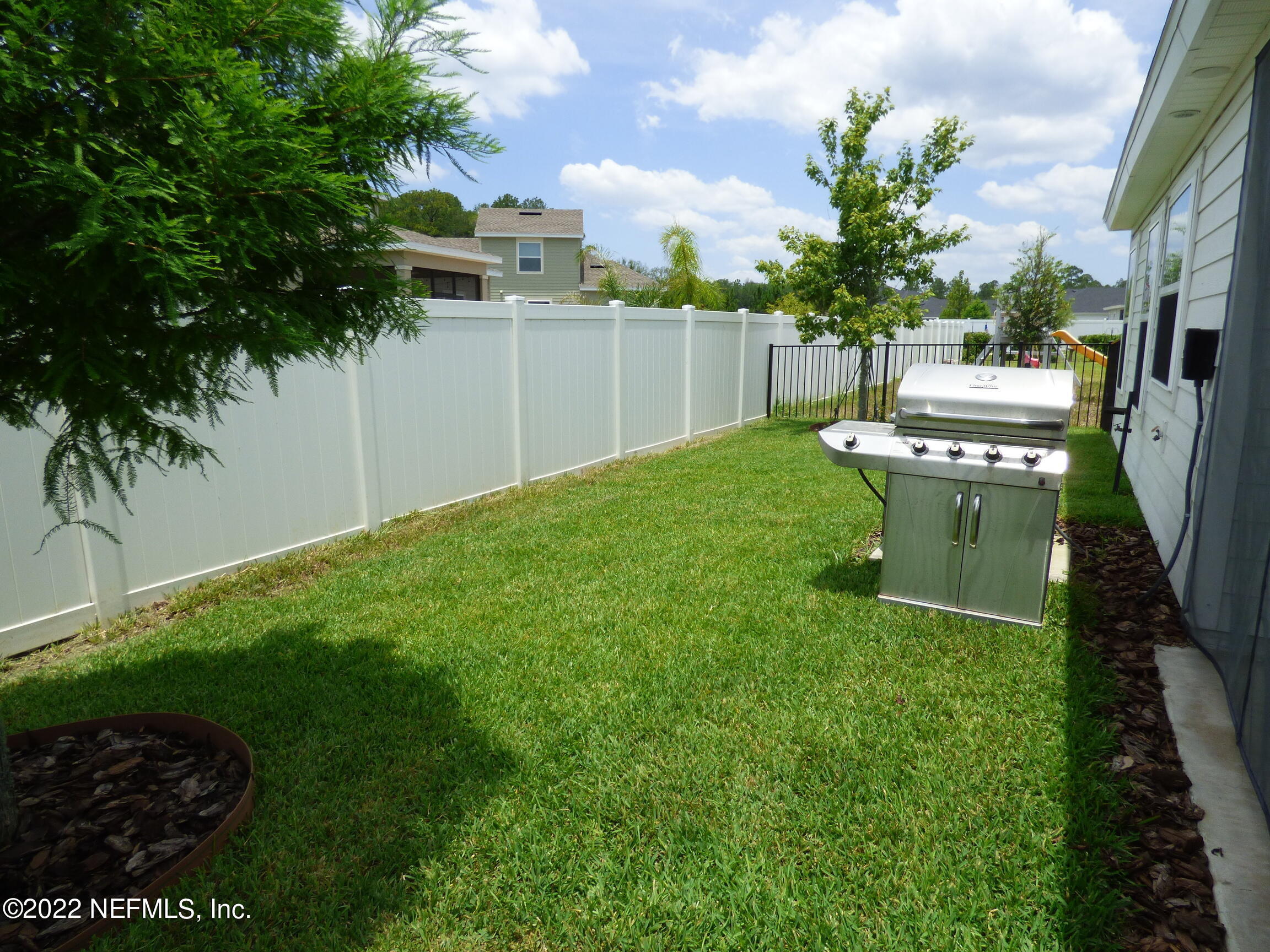 313 Bluejack Lane St. Augustine, FL 32095 - Photo 31 of 46 a view of a backyard with a garden