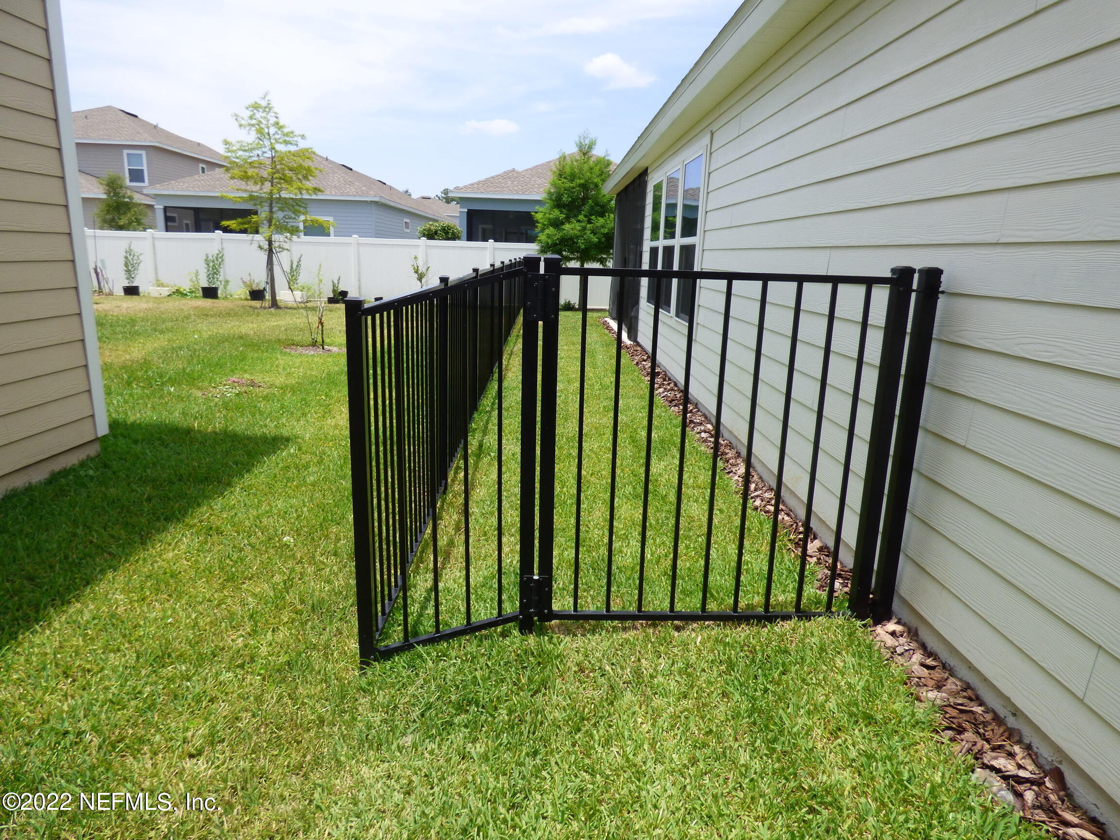 313 Bluejack Lane St. Augustine, FL 32095 - Photo 33 of 46 a view of a backyard with garden