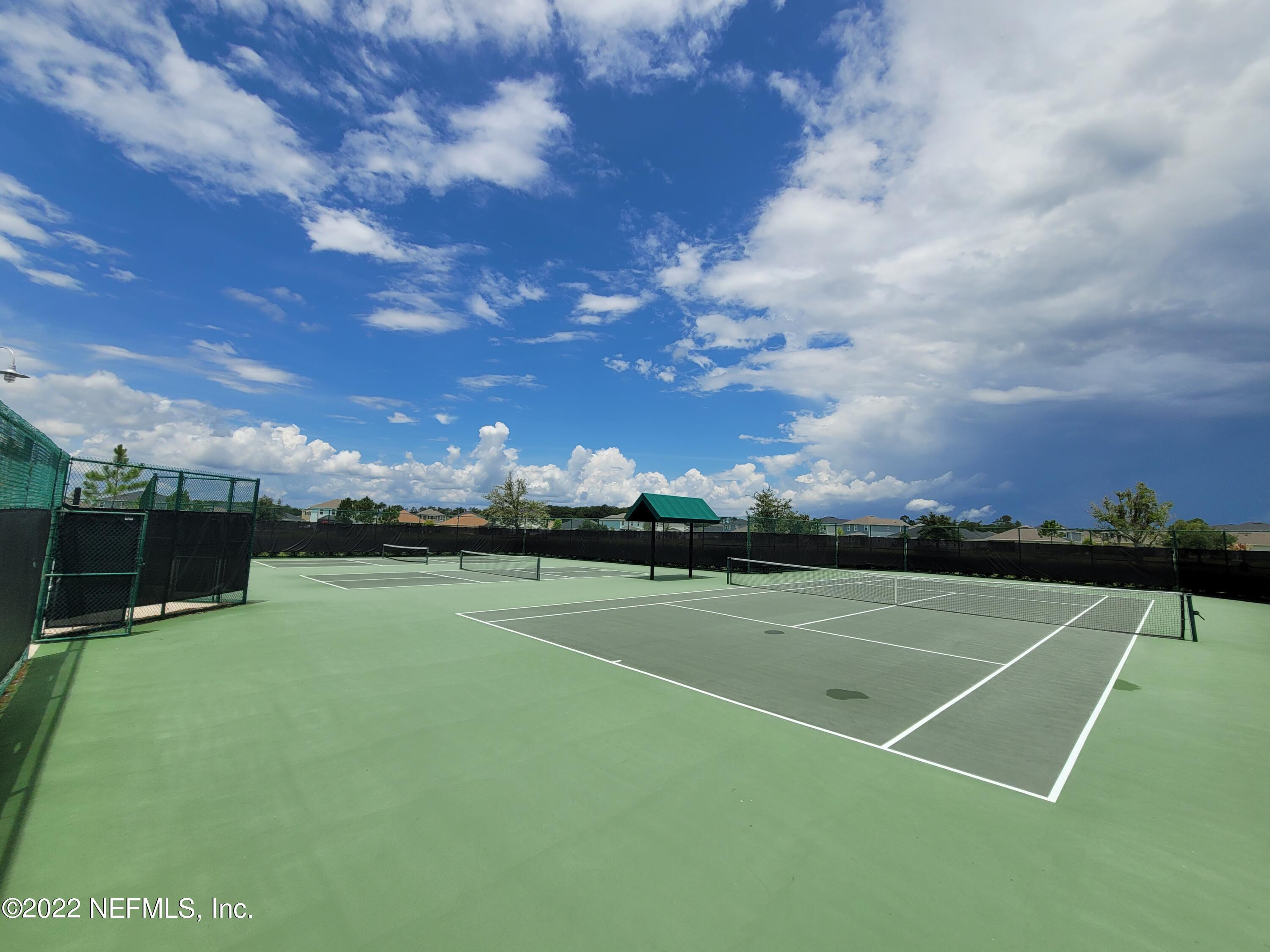 313 Bluejack Lane St. Augustine, FL 32095 - Photo 38 of 46 a view of an outdoor space and tennis court