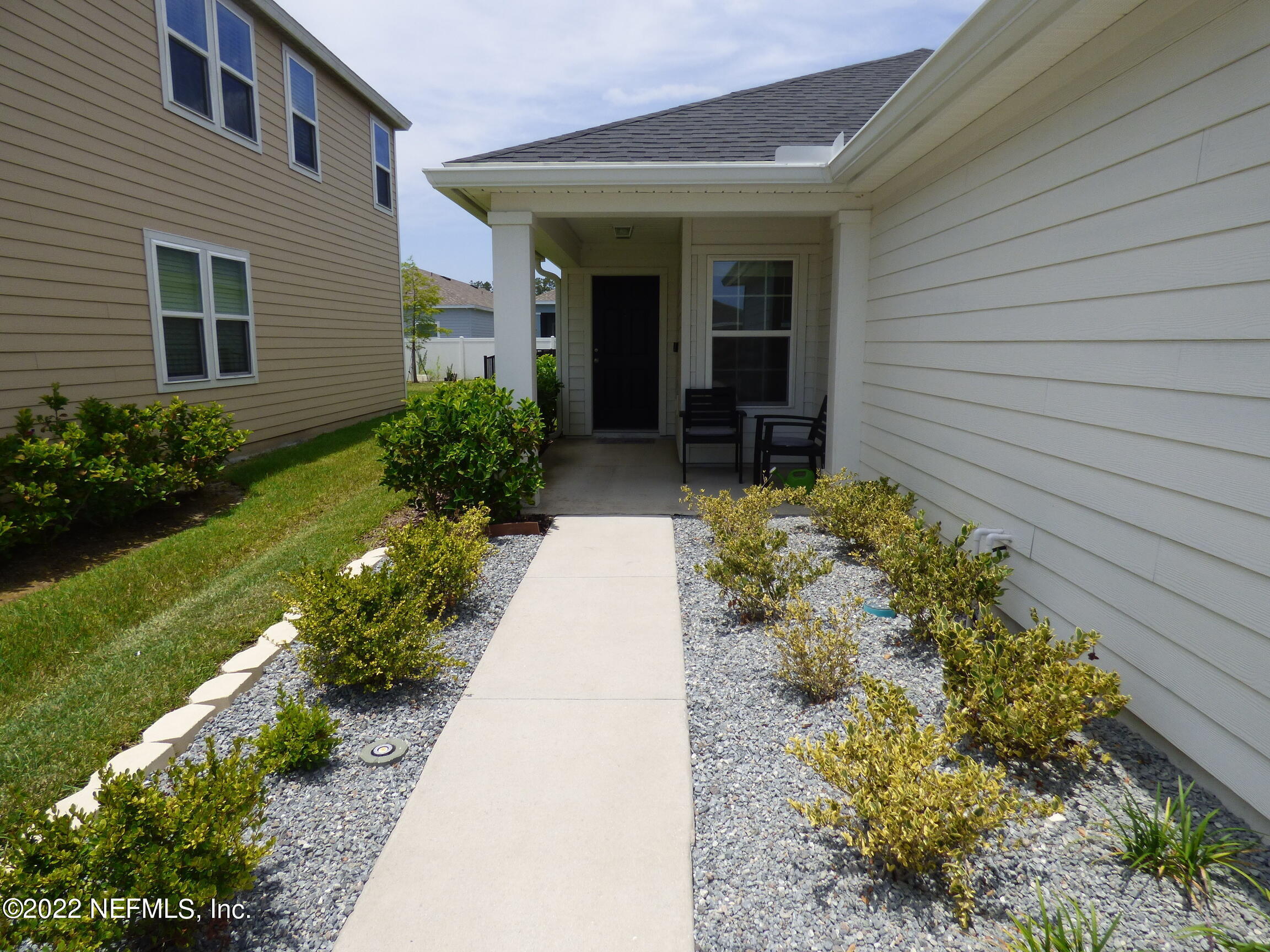 313 Bluejack Lane St. Augustine, FL 32095 - Photo 4 of 46 a view of a backyard with potted plants