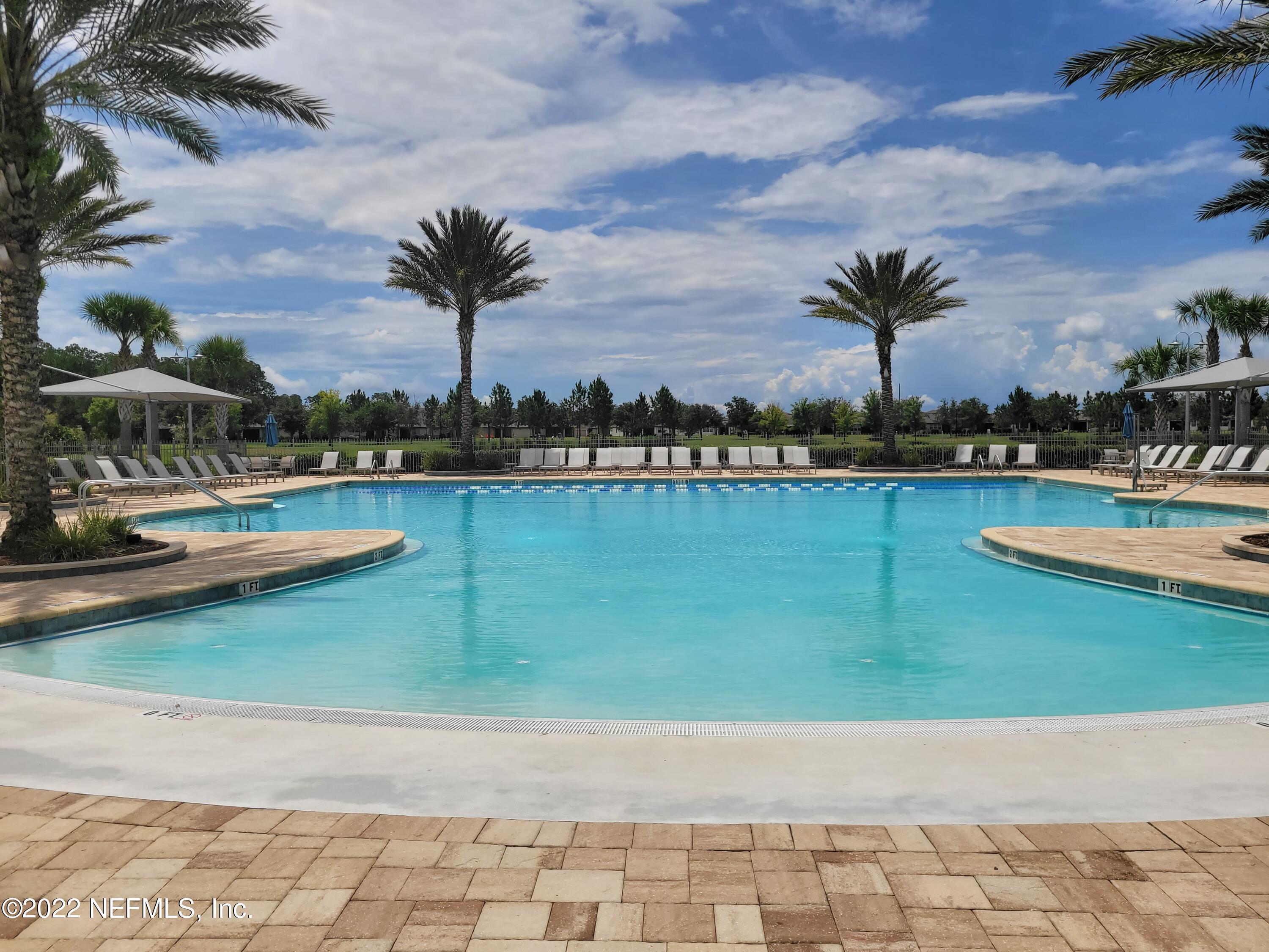 313 Bluejack Lane St. Augustine, FL 32095 - Photo 41 of 46 a view of a swimming pool and lounge chair