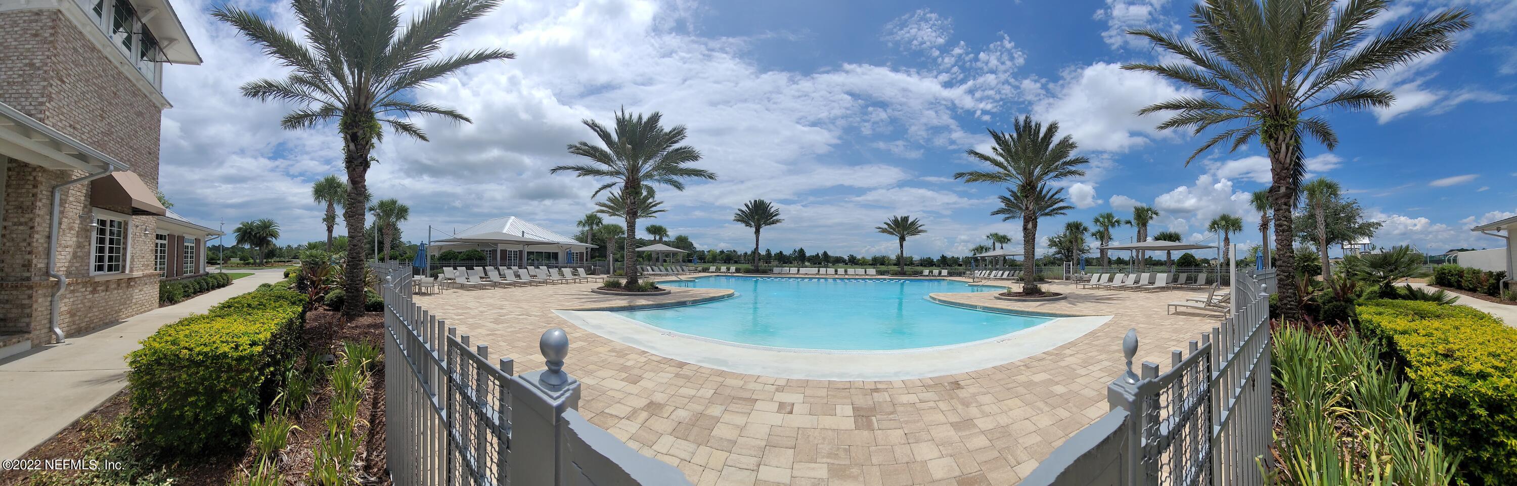 313 Bluejack Lane St. Augustine, FL 32095 - Photo 42 of 46 a view of a swimming pool with a yard and plants