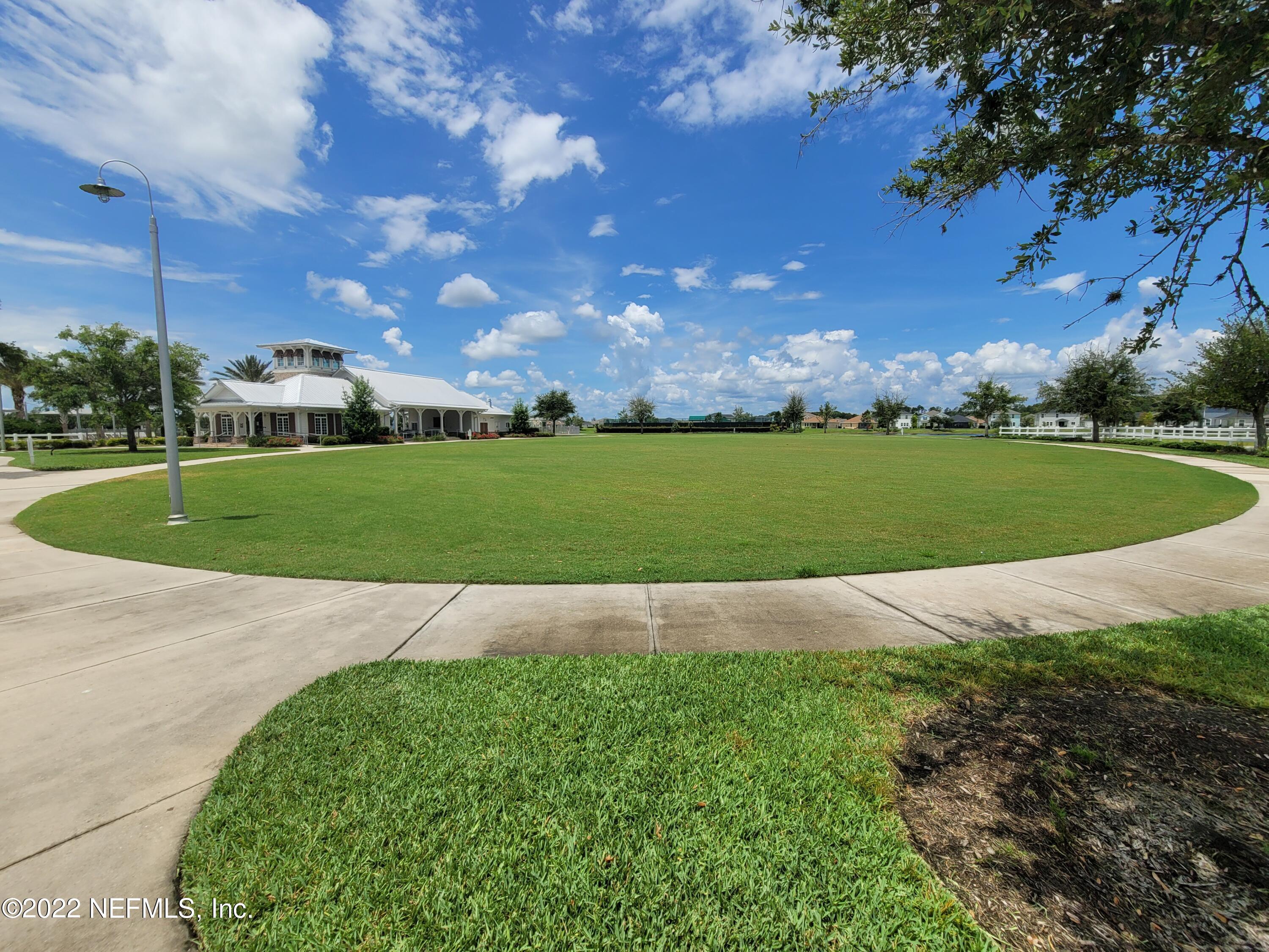 313 Bluejack Lane St. Augustine, FL 32095 - Photo 44 of 46 a view of a golf course with a big yard