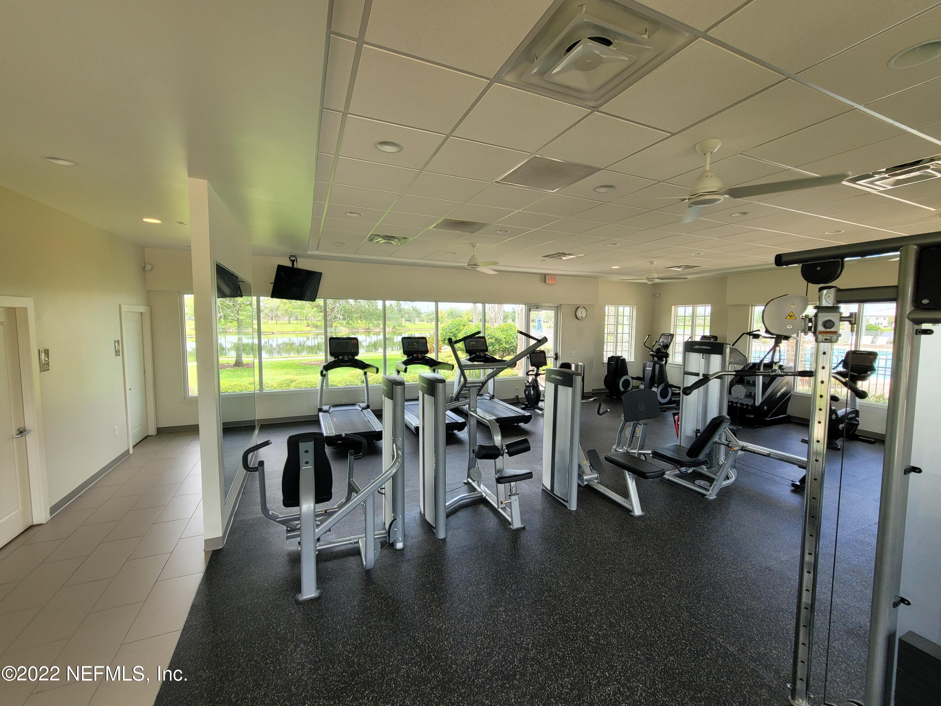 313 Bluejack Lane St. Augustine, FL 32095 - Photo 46 of 46 a view of a dining hall with lots of tables a chairs and chandelier
