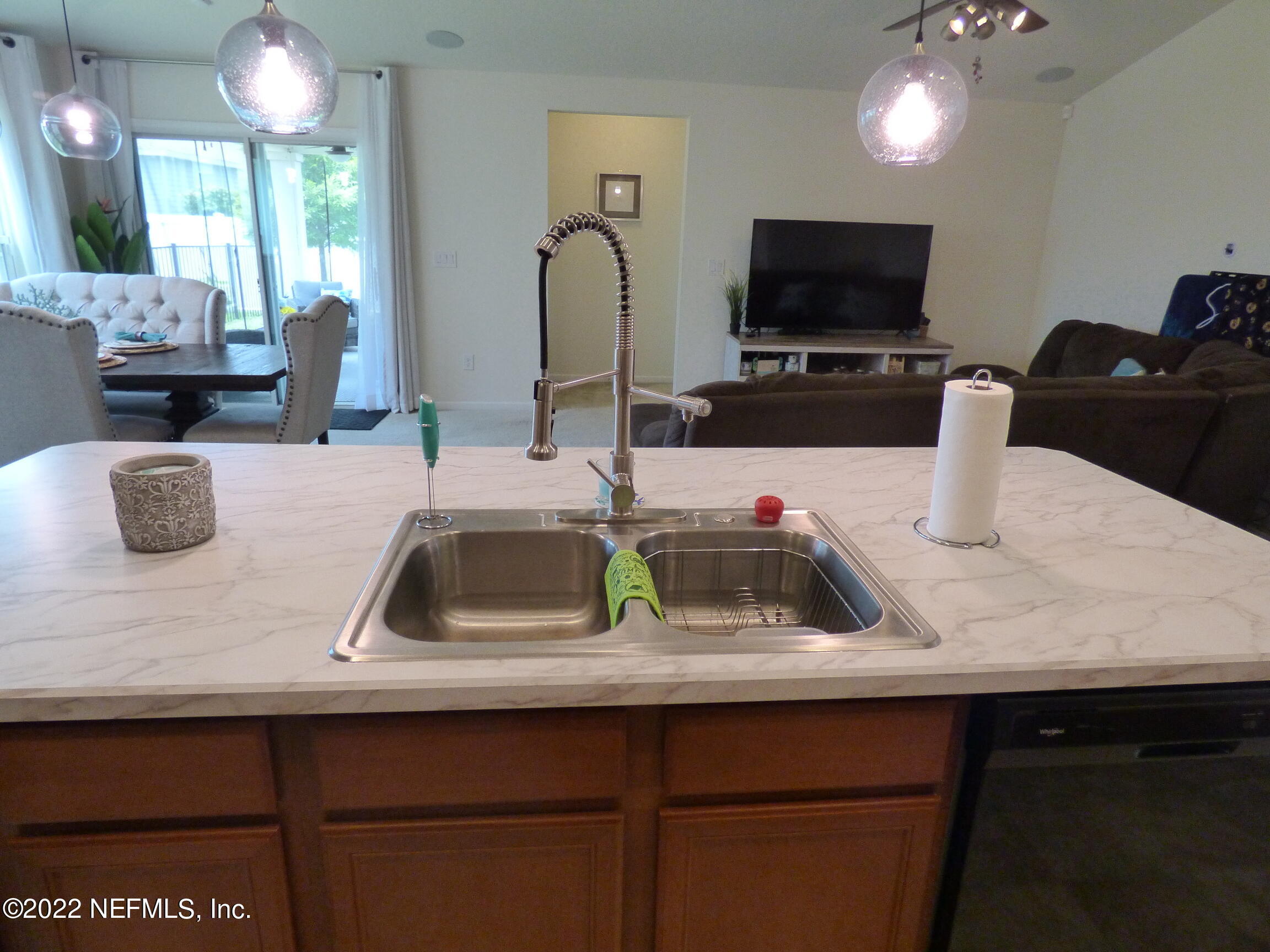 313 Bluejack Lane St. Augustine, FL 32095 - Photo 9 of 46 a kitchen with a sink a counter and cabinets