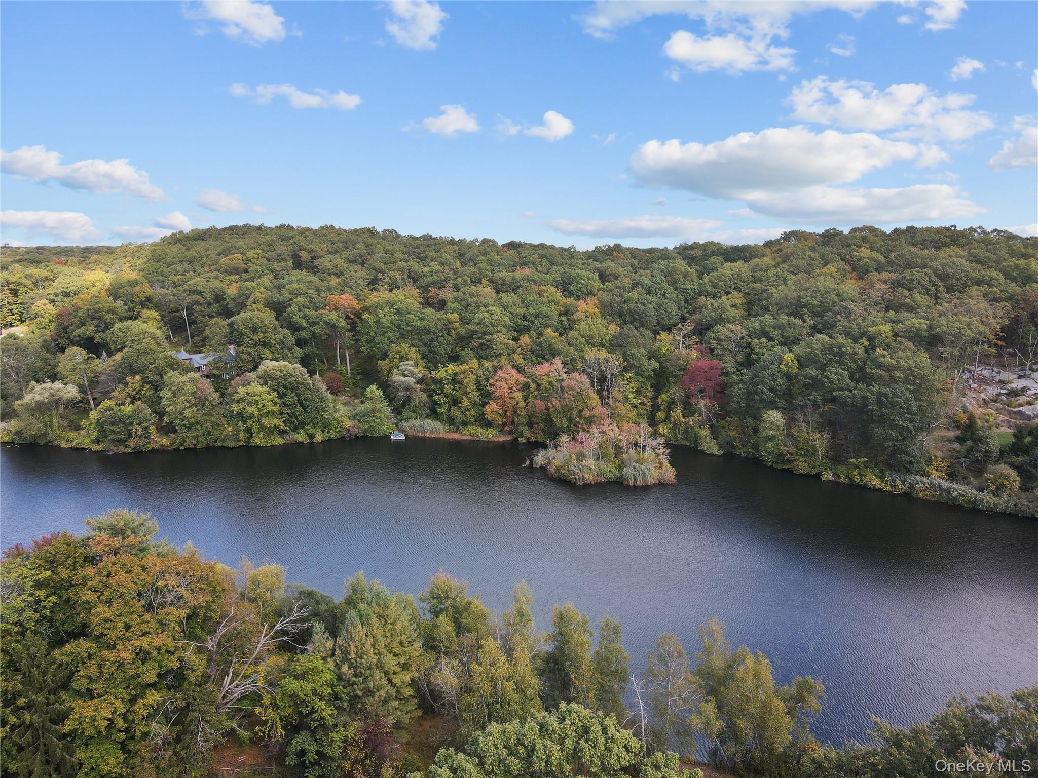 76 Byram Ridge Road Armonk, NY 10504 - Photo 6 of 11 a view of a lake with a mountain