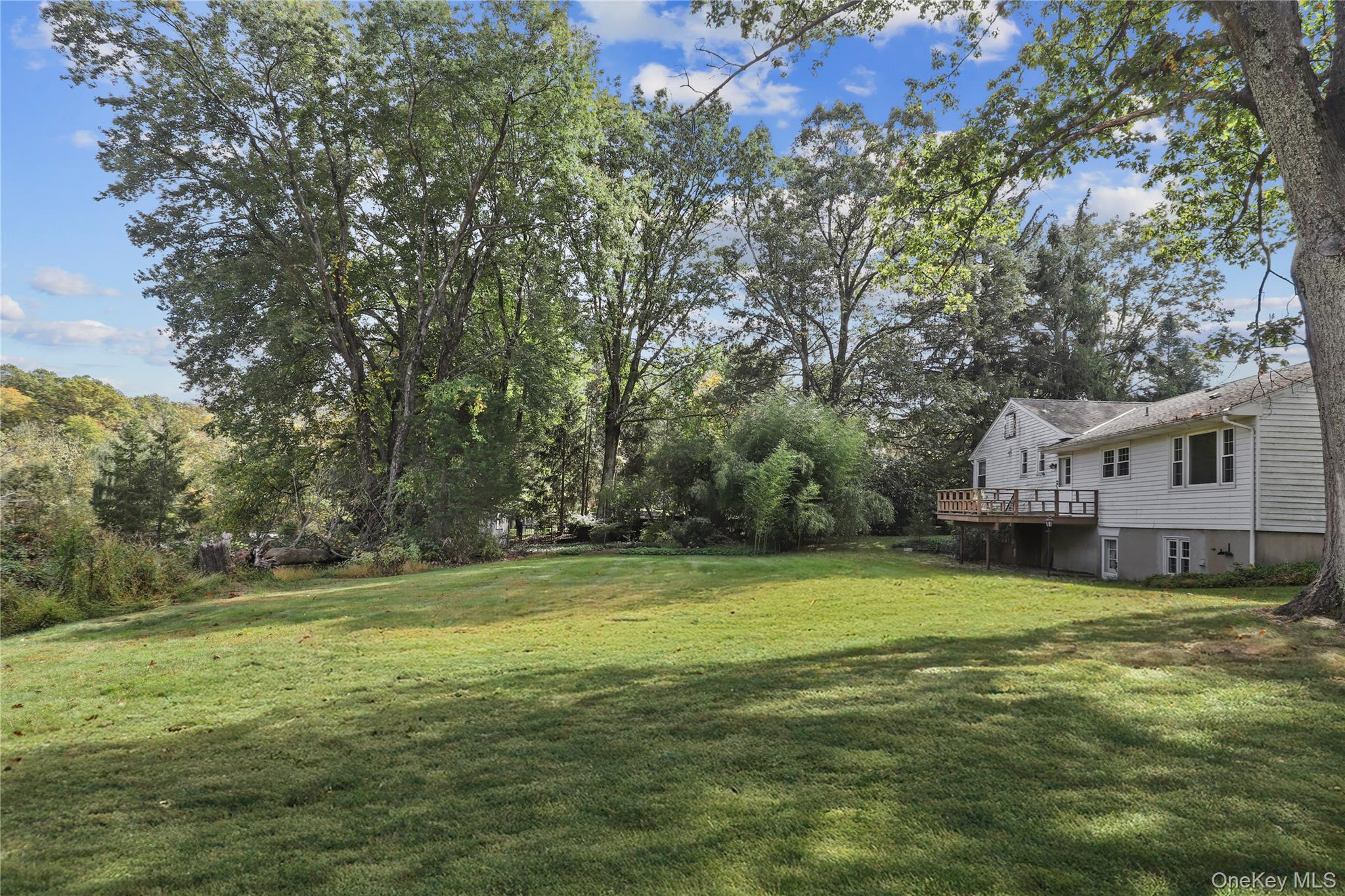 76 Byram Ridge Road Armonk, NY 10504 - Photo 8 of 11 a view of a house with a big yard