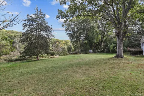 a view of a field with trees
