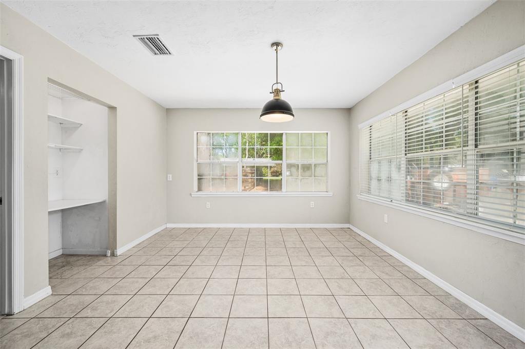 6820 Southwest 78th Street Gainesville, FL 32608 - Photo 13 of 41 a view of an empty room with windows