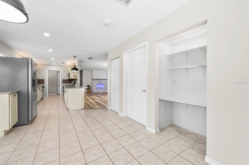 6820 Southwest 78th Street Gainesville, FL 32608 - Photo 14 of 41 a large white room with kitchen