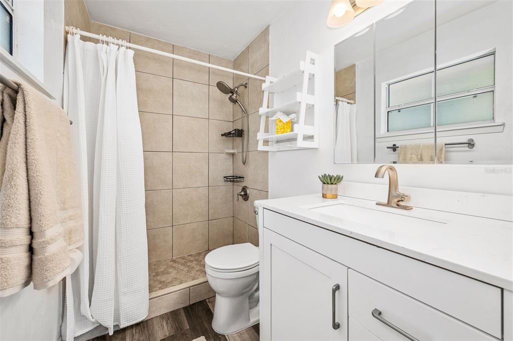 6820 Southwest 78th Street Gainesville, FL 32608 - Photo 18 of 41 a bathroom with a sink a toilet and shower