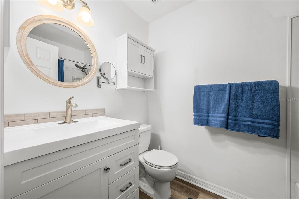 6820 Southwest 78th Street Gainesville, FL 32608 - Photo 20 of 41 a bathroom with a toilet a sink and a mirror