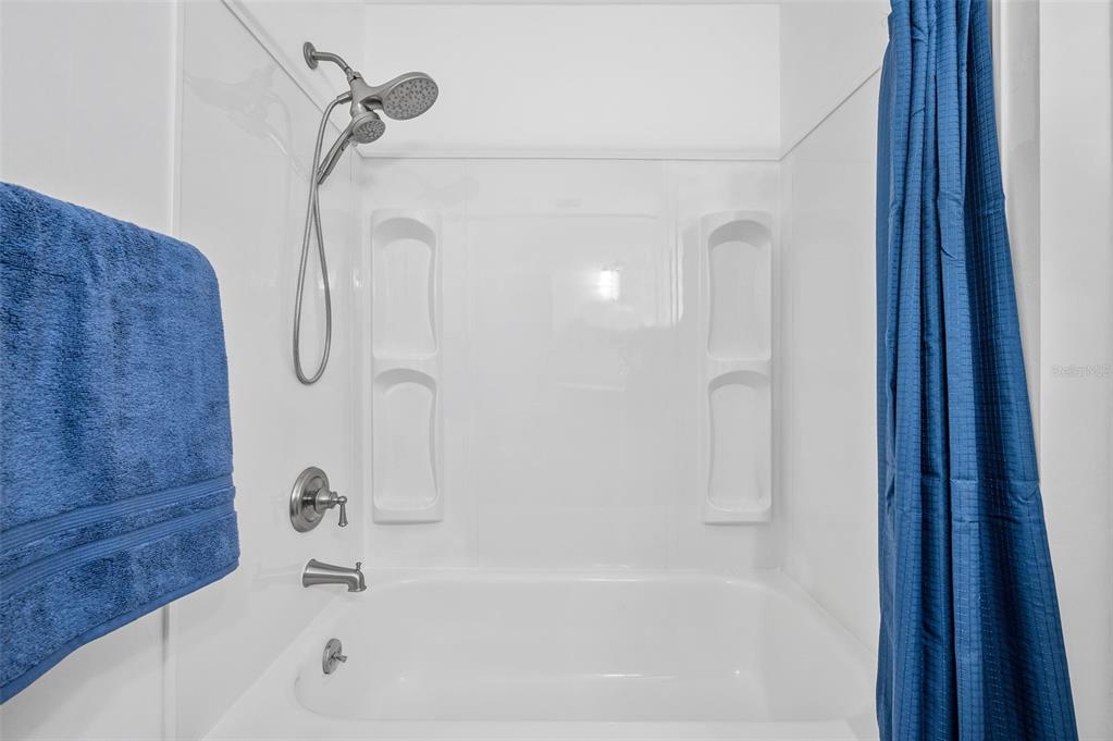 6820 Southwest 78th Street Gainesville, FL 32608 - Photo 21 of 41 a bathroom with a bath tub with a shower