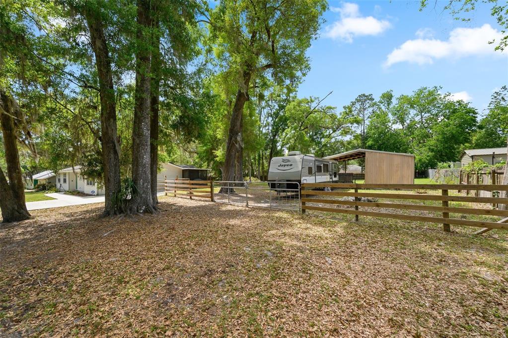6820 Southwest 78th Street Gainesville, FL 32608 - Photo 39 of 41 a view of a yard with wooden fence
