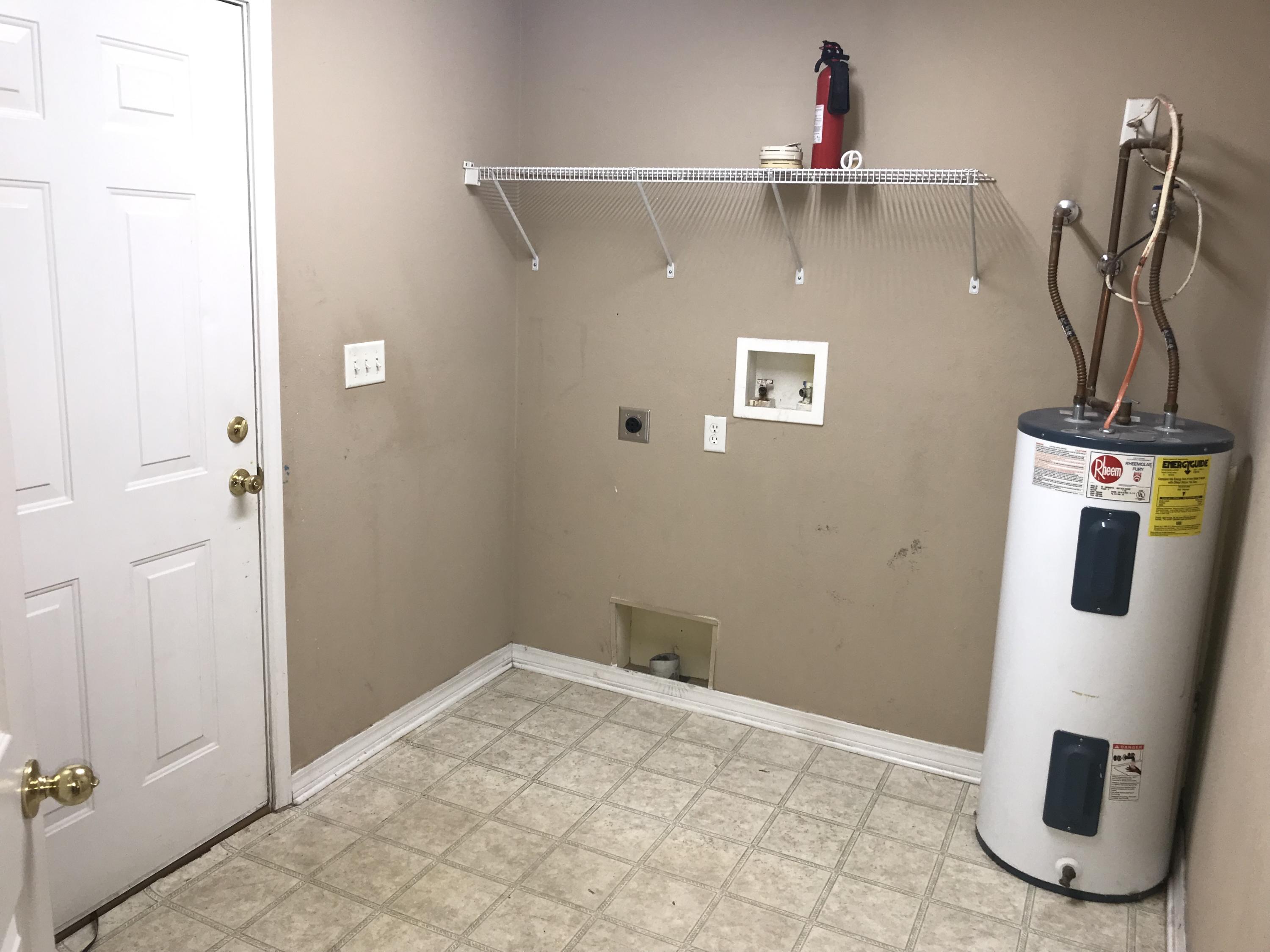 220 Tiffot Court Crestview, FL 32539 - Photo 13 of 15 a view of an entryway with wooden floor