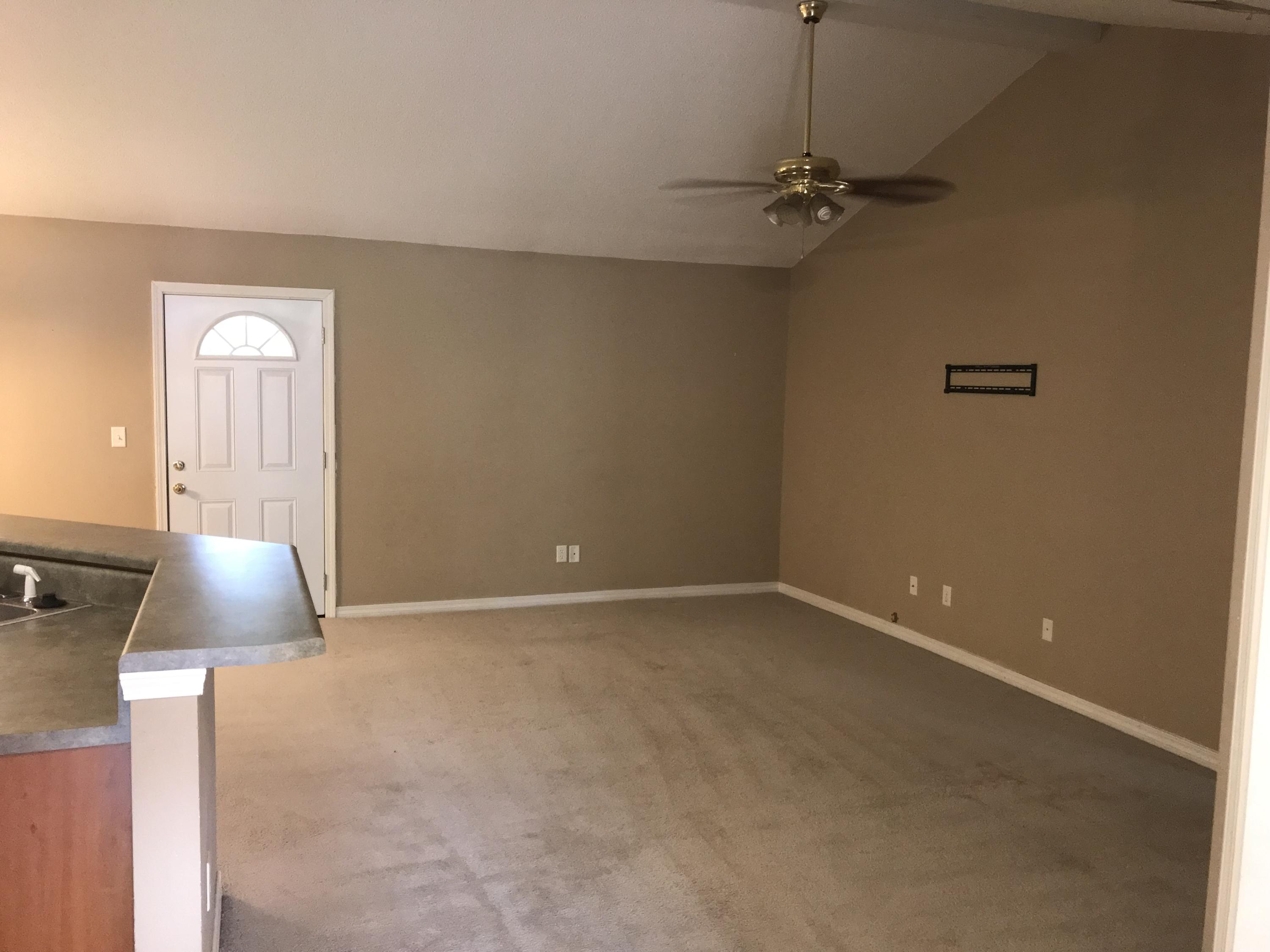 220 Tiffot Court Crestview, FL 32539 - Photo 3 of 15 a view of a room with a ceiling fan and a window