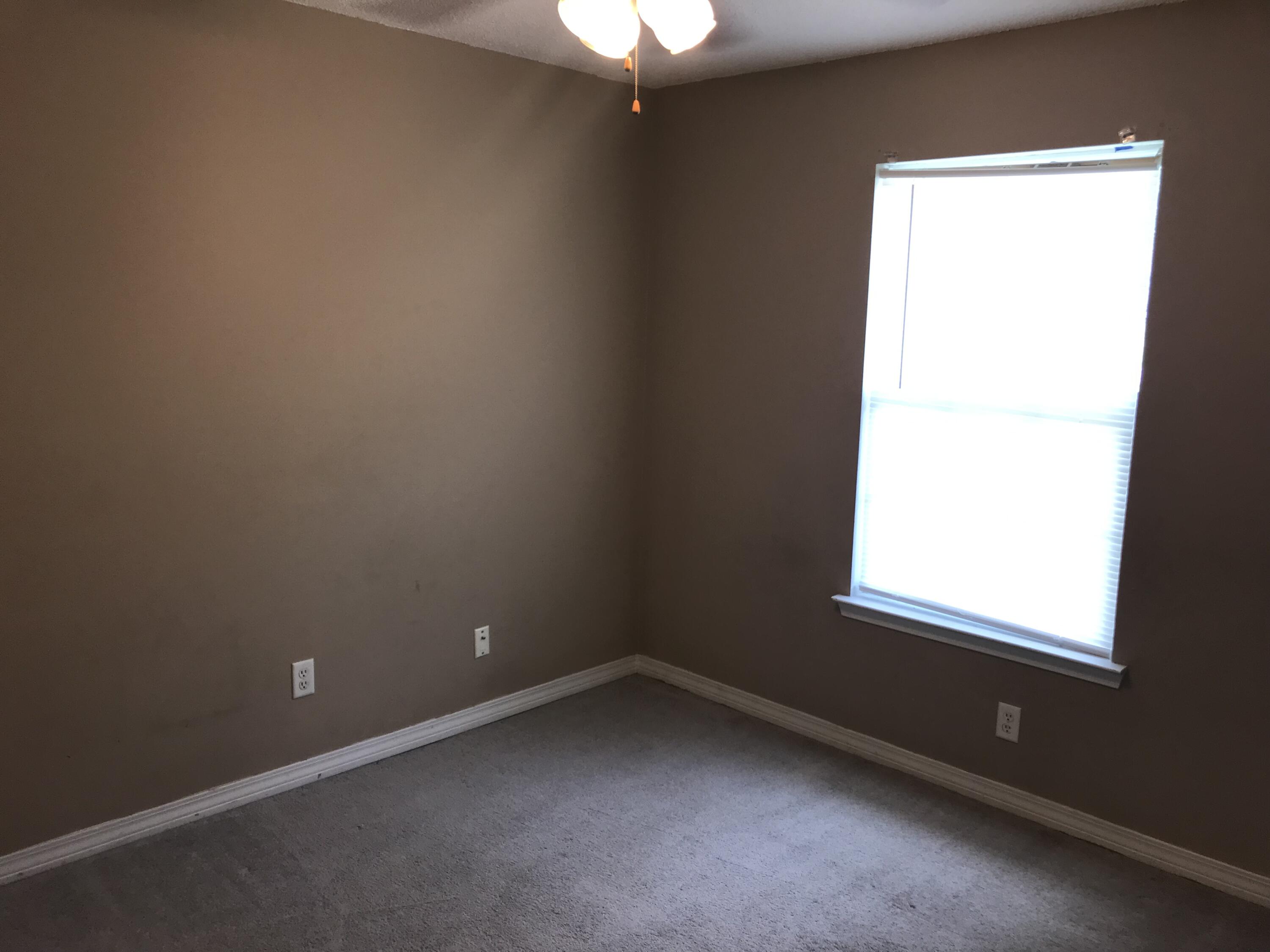 220 Tiffot Court Crestview, FL 32539 - Photo 4 of 15 an empty room with a window