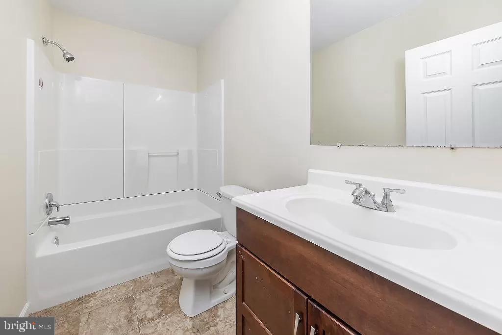 6 Cornell Road Glassboro, NJ 08028 - Photo 4 of 15 a bathroom with a sink a toilet and a bathtub