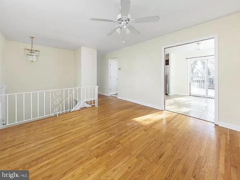 6 Cornell Road Glassboro, NJ 08028 - Photo 7 of 15 an empty room with wooden floor and windows