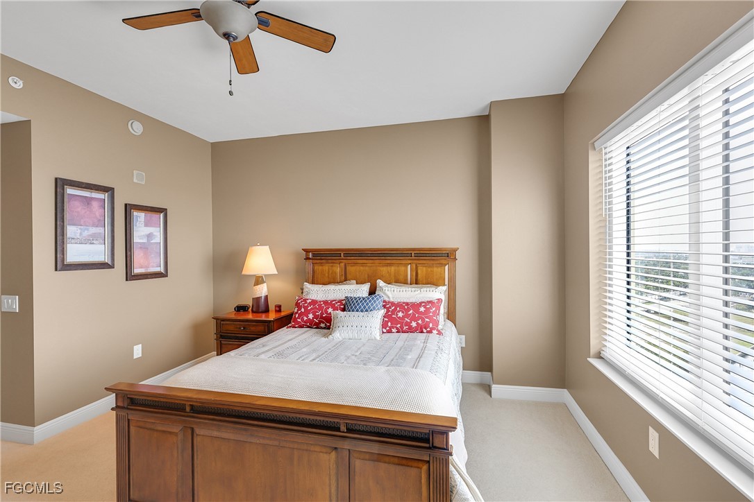 2743 First Street, Unit 1502 Fort Myers, FL 33916 - Photo 25 of 35 a bedroom with a bed and a dresser