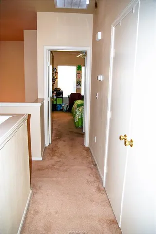 a view of a kitchen from the hallway